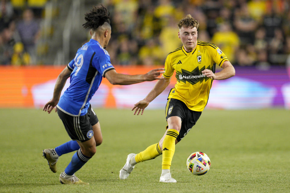 Columbus Crew midfielder Aidan Morris, right, controls the ball against CF Montréal midfielder Nathan-Dylan Saliba, left, during the second half of an MLS soccer match against CF Montréal, Saturday, April 27, 2024, in Columbus, Ohio. (AP Photo/Jeff Dean)