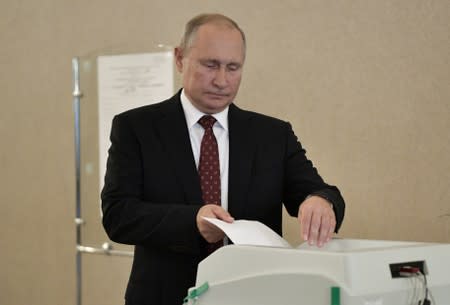 Russia's President Putin casts his ballot at a polling station during the Moscow city parliament election in Moscow