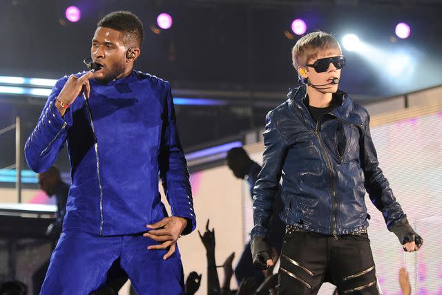 <p>Kevin Mazur/WireImage</p> Usher and Justin Bieber perform at the 2011 Grammy Awards.