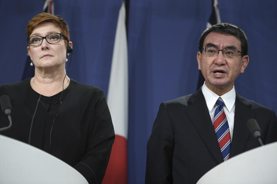 Japanese Foreign Minister Taro Kono, right, speaks as Australian Foreign Minister Marise Payne listens during a joint press conference in Sydney, Wednesday, Oct. 10, 2018. Australia and Japan on Wednesday reaffirmed their commitment to pressuring North Korea to abandon its nuclear weapons program and enforcing sanctions on Pyongyang. (Dan Himbrechts/AAP Images via AP)