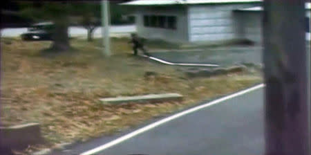 A CCTV footage shows a North Korean soldier crossing the white Military Demarcation Line during a United Nations Command (UNC) briefing on the investigation results of the soldierÕs defection, at the South Korean defence ministry in Seoul in this still image taken from a Reuters TV video, November 22, 2017. REUTERS/Reuters TV