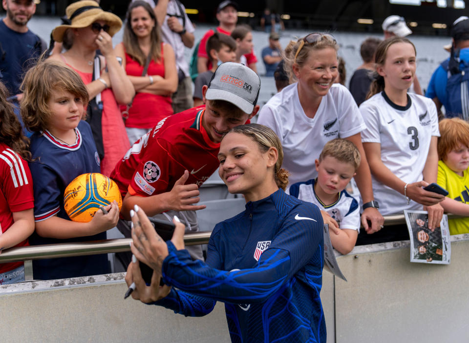 Trinity Rodman takes a selfie with fans after a game between <a class="link " href="https://sports.yahoo.com/soccer/teams/new-zealand-women/" data-i13n="sec:content-canvas;subsec:anchor_text;elm:context_link" data-ylk="slk:New Zealand;sec:content-canvas;subsec:anchor_text;elm:context_link;itc:0">New Zealand</a> and USWNT at Eden Park in Auckland, New Zealand, on Jan. 21, 2023.<span class="copyright">Brad Smith—ISI Photos/Getty Images</span>