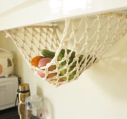 A macrame hanging fruit hammock