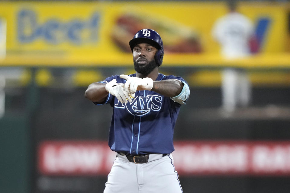 Tampa Bay Rays' Randy Arozarena looks at his teammates in the dugout after hitting a two-run double off Chicago White Sox relief pitcher Dominic Leone during the sixth inning of a baseball game Saturday, April 27, 2024, in Chicago. (AP Photo/Charles Rex Arbogast)