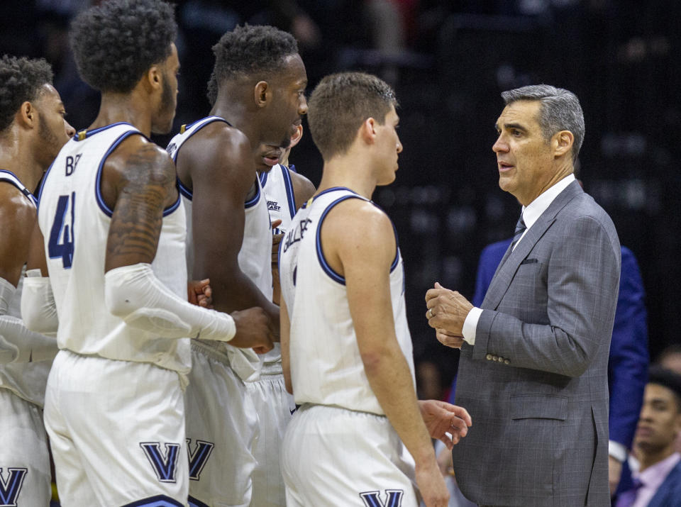 Villanova head coach Jay Wright talks to his players during a break in the action in the first half of an NCAA college basketball game against Providence, Saturday, Feb. 29, 2020, in Philadelphia, Pa. (AP Photo/Laurence Kesterson)