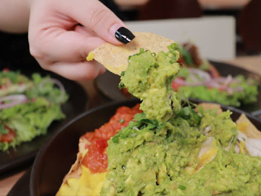 avo - holding up chips with dip