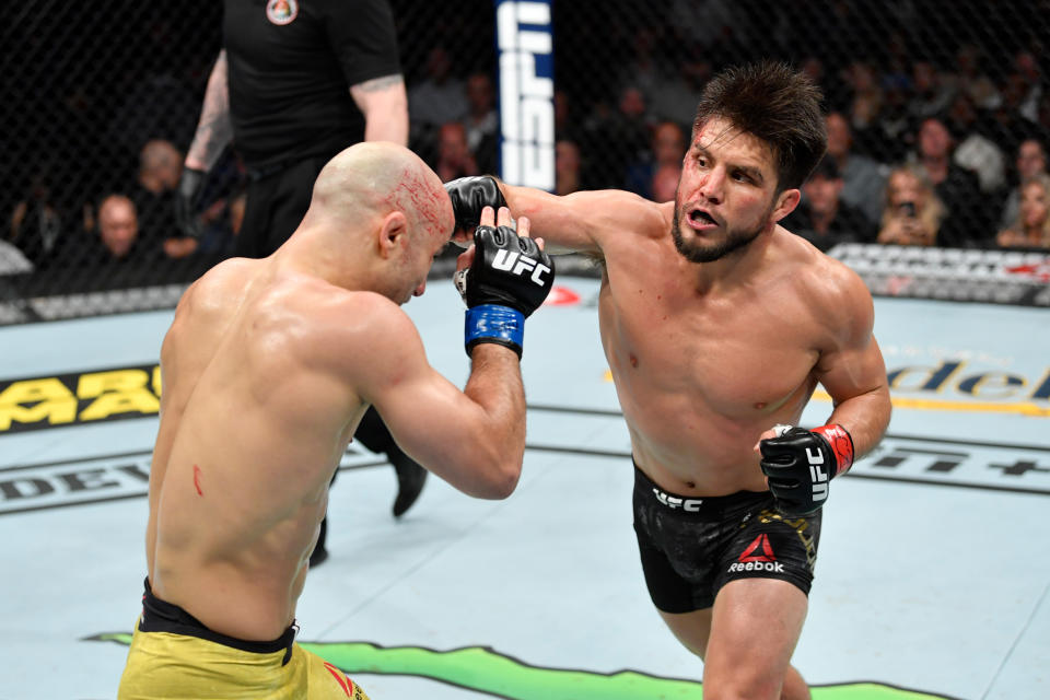 CHICAGO, IL - JUNE 08:  (R-L) Henry Cejudo punches Marlon Moraes of Brazil in their bantamweight championship bout during the UFC 238 event at the United Center on June 8, 2019 in Chicago, Illinois. (Photo by Jeff Bottari/Zuffa LLC/Zuffa LLC via Getty Images)