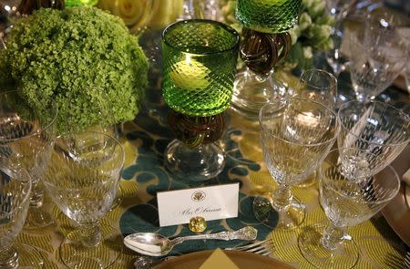 A place setting for U.S. First lady Michelle Obama and menu for the State Dinner welcoming Canadian Prime Minister Justin Trudeau and his wife Sophie Gregoire Trudeau are seen during a press preview in the State Dining Room of the White House in Washington March 9, 2016. REUTERS/Gary Cameron