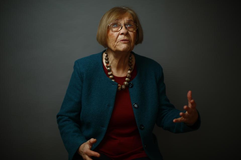 Auschwitz death camp survivor Elzbieta Sobczynska gestures as she poses for a portrait in Warsaw