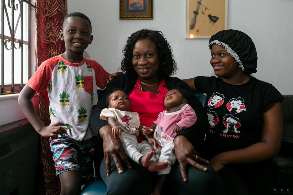 Kerlyne Paraison, center, a Haitian TPS holder, is surrounded by her children at their home in Miami’s Little River neighborhood on Tuesday, June 15, 2021. From left to right: Kevin, 7, Kiara, Kerlyne Paraison, Kemora and Christephane, 12.