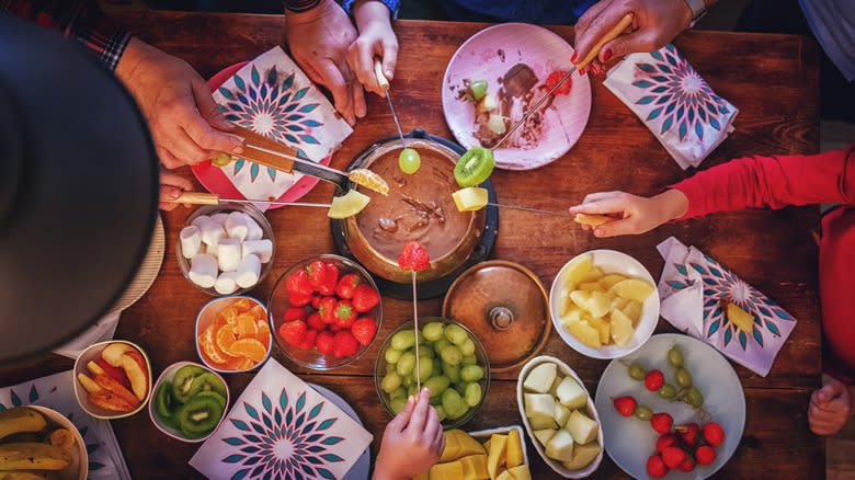 Fruit dipped into chocolate fondue