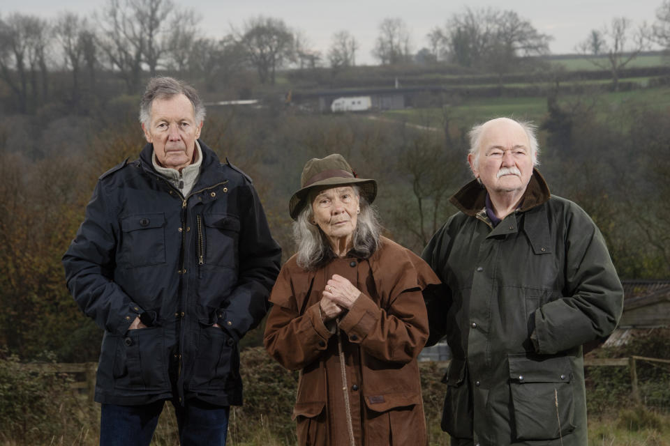 BNPS.co.uk (01202 558833)
Pic: BNPS

EMBARGO - IMAGES NOT TO BE USED ONLINE BEFORE 9AM TUESDAY (05/12/23) - EMBARGO

Pictured:  West Compton villagers,  Stuart Vaughan, Liz Mayhew and her husband Mike. The controversial self-built the contemporary family home is pictured on the hill in the background.

A well-respected businessman is facing the daunting prospect of demolishing his new home after illegally building it during lockdown.   

Tony Harvey failed to obtain planning permission when he self-built the contemporary family home near Glastonbury, Somerset. 

The controversial property - worth about Â£400,000 - sits on agricultural land once owned by his late grandfather in the village of West Compton.