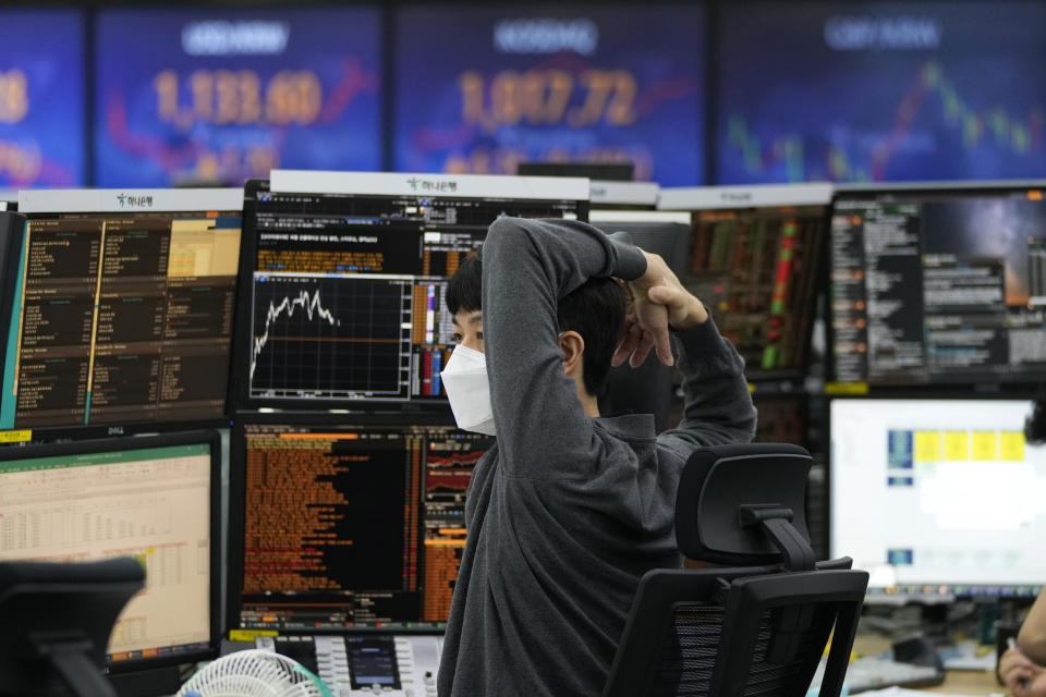 A currency trader watches monitors at the foreign exchange dealing room of the KEB Hana Bank headquarters in Seoul, South Korea, Wednesday, June 23, 2021. Asian stock markets followed Wall Street higher on Wednesday after the Federal Reserve chairman said higher U.S. inflation probably is temporary, helping to calm fears central bankers might feel pressure to roll back economic stimulus. (AP Photo/Ahn Young-joon)