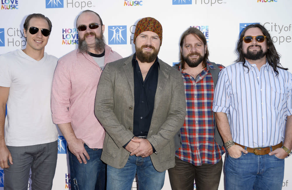 John Driskell Hopkins (centre) has been diagnosed with ALS credit:Bang Showbiz