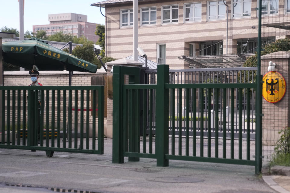 A paramilitary police officer stands guard outside the German Embassy in Beijing, China, Monday, Sept. 6, 2021. Jan Hecker, Germany's new ambassador to China, a former adviser to Chancellor Angela Merkel, has died, the German Foreign Ministry said Monday. (AP Photo/Ng Han Guan)