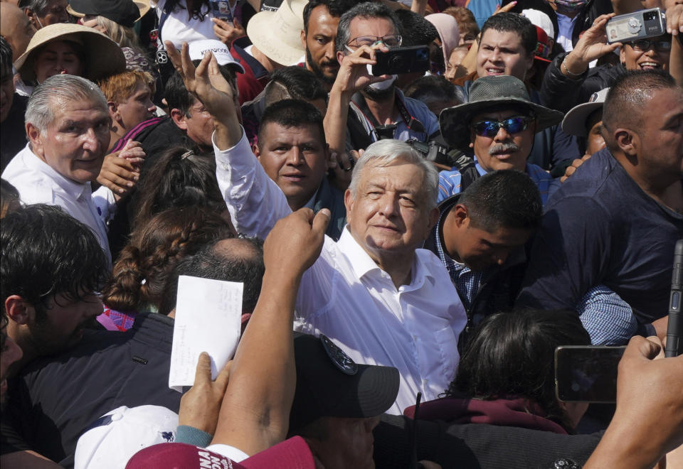 Mexican President Andrés Mexican President Andrés Manuel Lopez Obrador, right, waves during a march in support of his administration, in Mexico City, Sunday, Nov. 27, 2022.(AP Photo/Fernando Llano)