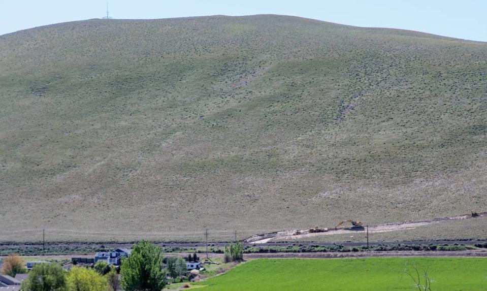 Benton County ordered a Candy Mountain land owner to stop excavation work along Kennedy Road near West Richland.
