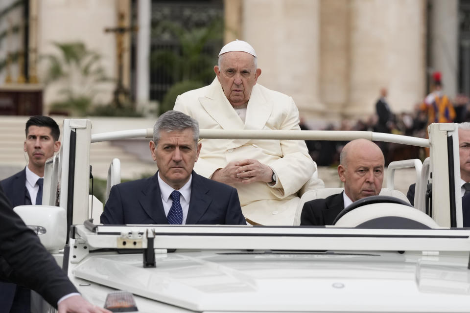 Pope Francis arrives to celebrate the Palm Sunday's mass in St. Peter's Square at The Vatican Sunday, April 2, 2023 a day after being discharged from the Agostino Gemelli University Hospital in Rome, where he has been treated for bronchitis, The Vatican said. The Roman Catholic Church enters Holy Week, retracing the story of the crucifixion of Jesus and his resurrection three days later on Easter Sunday. (AP Photo/Andrew Medichini)