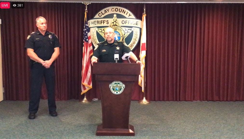 Clay County Undersheriff Ron Lendvay (center) announces the arrest of Jacksonville police officer Alejandro Carmona-Fonseca as Jacksonville Undersheriff Pat Ivey stands by.