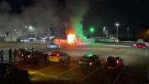 In this image made from video, a COVID-19 testing center is seen after being set on fire in Urk, 80 kilometers (50 miles) northeast of Amsterdam, Saturday, Jan. 23, 2021. Dutch police have clashed with protesters demonstrating against the country’s lockdown in the capital, Amsterdam and the southern city of Eindhoven. The unrest comes a day after rioting youths protesting on the first night of the country’s curfew torched a coronavirus testing facility in Dutch fishing village Urk. (Pro News via AP)