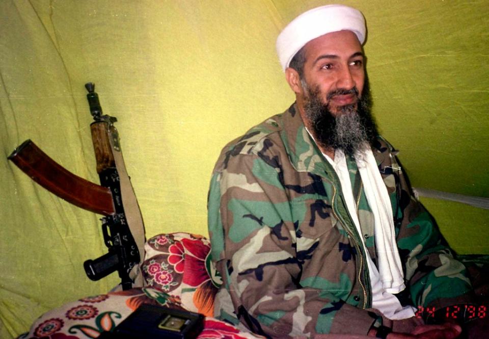 Osama Bin Laden speaks to a selected group of reporters in southern Afghanistan in 1998. AP