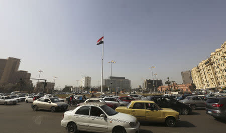 Egypt's national flutters in the wind from the top of a flag pole, which was recently installed in Tahrir square, in central Cairo, February 3, 2015. REUTERS/Mohamed Abd El Ghany