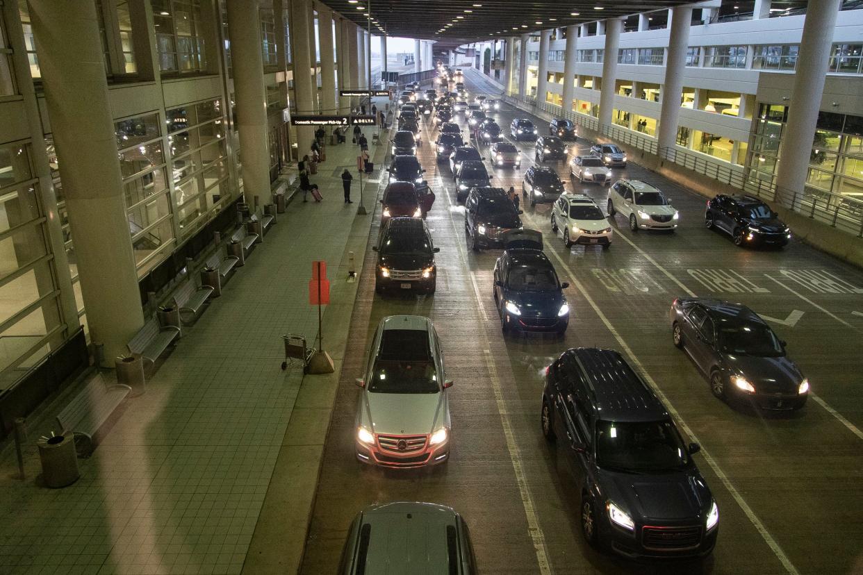 Air travel is expected to break a new record of 7.5 million passengers from Dec. 23 through Jan. 1, according to forecasts from AAA. File art: Passenger pick up lanes at the McNamara Terminal at Detroit Metro Airport in Romulus on Thursday, Dec. 22, 2022.