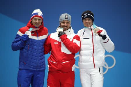 Feb 18, 2018; Pyeongchang, South Korea; Medalists from left Henrik Kristoffersen NOR) , Marcel Hirscher (AUT) and Alexis Pinturault (FRA) celebrate during the medals ceremony for the men's alpine skiing giant slalom in the Pyeongchang 2018 Olympic Winter Games at Medals Plaza. Mandatory Credit: Kevin Jairaj-USA TODAY Sports