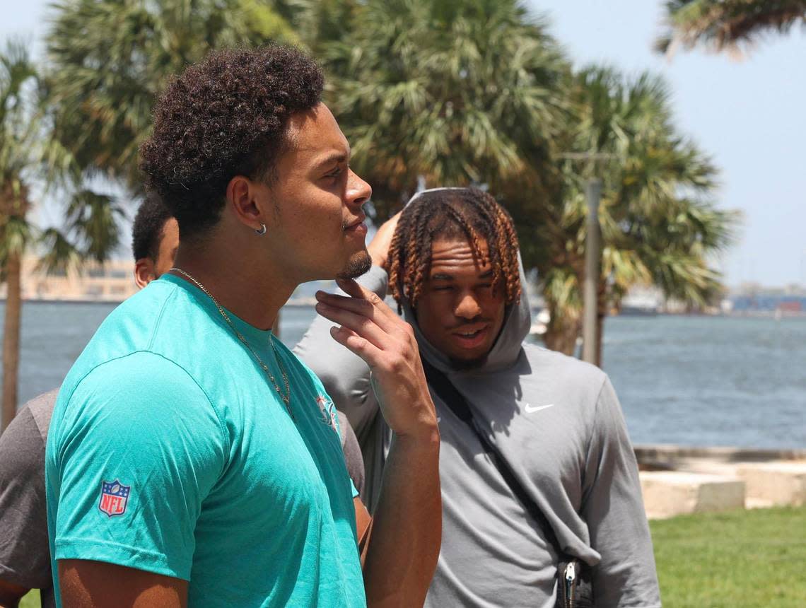 Cameron Goode, signed member of the Miami Dolphins rookie class, left, participates in a historic walking tour of Downtown Miami with local community groups on Wednesday, June 15, 2022 beginning with tour leaders at the History Miami Museum. Goode is one of four players actually signed to the roster for this coming season.