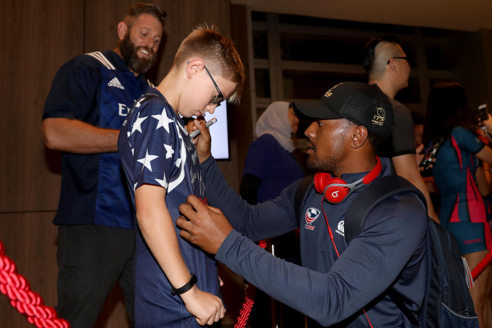 Carlin Isles of the United States greets fans during his team’s arrival for the HSBC Singapore Rugby Sevens tournament. (PHOTO: Paul Miller/Getty Images for Singapore Sports Hub)