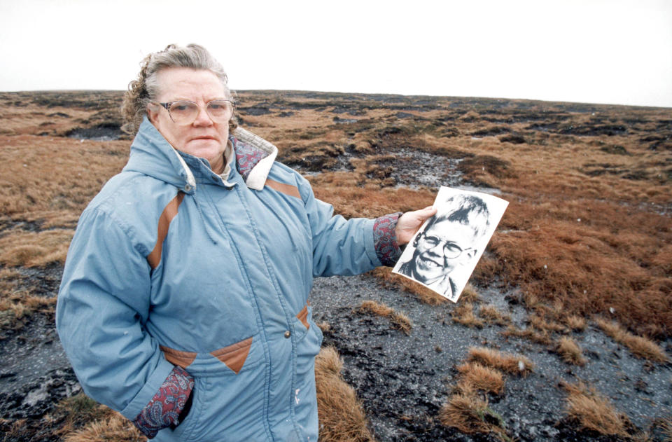 Mrs Winifred Johnson, mother of missing boy Keith Bennett, pictured on Saddleworth Moor, with a photograph of her son, January 25, 1995.  / Credit: / Getty Images