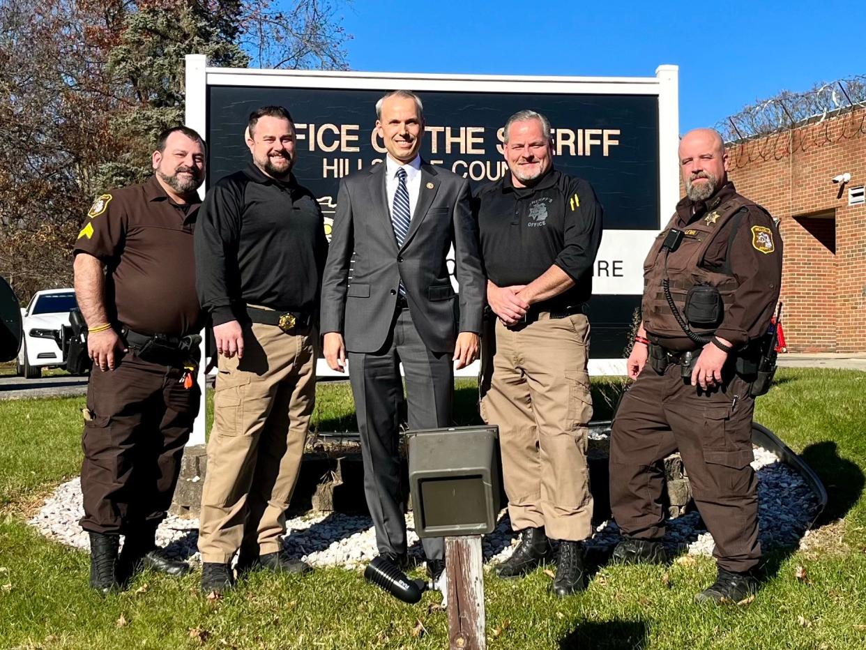 Sgt. John Gates, Undersheriff Nate Lambright, U.S. Attorney Mark Totten, Sheriff Mark Hodshire and Deputy TJ Leva pose for a photo Tuesday at the Hillsdale County Sheriff's Office.
