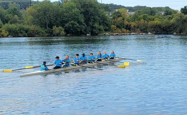 A crew of eight man the oars in a rowing shell as part of the Massachusetts Public School Rowing Association’s Fall Championship Regatta on South Watuppa Pond on Oct. 31, 2021.