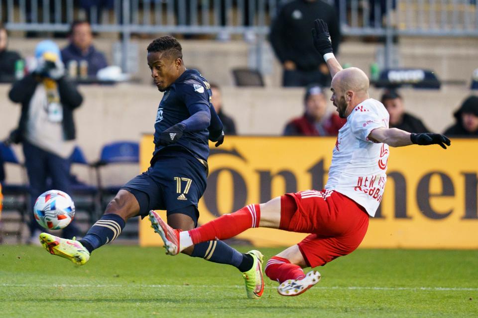 Sergio Santos, left, playing for the Philadelphia Union in November 2021, takes a shot as New York Red Bulls' Andrew Gutman defends. He joins FC Cincinnati in 2022.