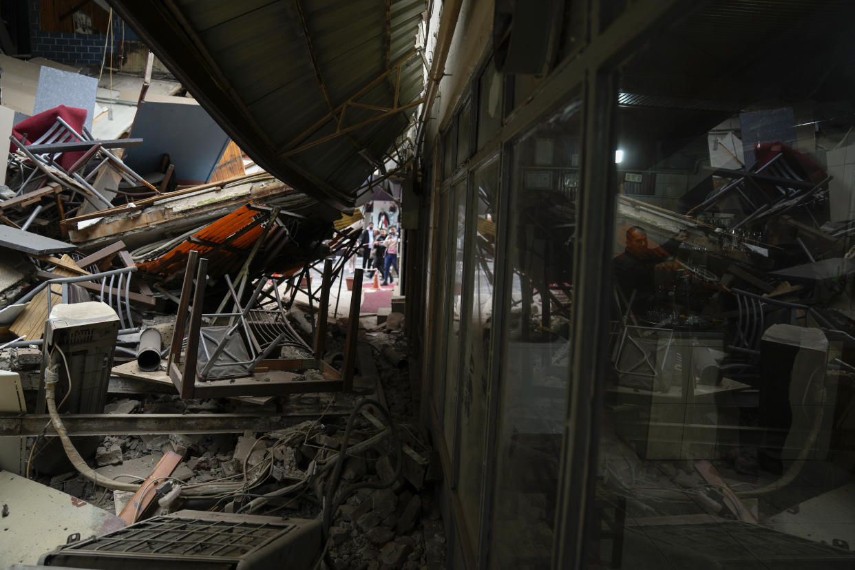 Damaged shops in Duzce, Turkey, Wednesday, Nov. 23, 2022, after a magnitude 5.9 earthquake hit a town in northwest Turkey early Wednesday, causing damage to some buildings and widespread panic. At least 68 people were injured, mostly while trying to flee homes. The earthquake was centered in the town of Golkaya, in Duzce province, some 200 kilometers (125 miles) east of Istanbul, the Disaster and Emergency Management Presidency said.(AP Photo/Khalil Hamra)