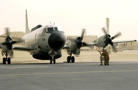 FILE PHOTO: A U.S. Navy EP-3E Aries aircraft is directed by ground crew after a flight from Bahrain September 25, 2017. U.S. Air Force/Staff Sgt. Rhiannon Willard/Handout/File photo via REUTERS ATTENTION EDITORS - THIS IMAGE WAS PROVIDED BY A THIRD PARTY