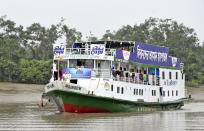 In this photo provided by Bidyanondo Foundation, floating hospital called ‘Jibon Kheya’,meaning lifeboat, arrives at Banishanta near Mongla seaport in southwestern region of Bangladesh, Sept. 1, 2020.. A Bangladeshi charity has set up a floating hospital turning a small tourist boat into a healthcare facility to provide services to thousands of people affected by this year's devastating floods that marooned millions. (Bidyanondo Foundation via AP)