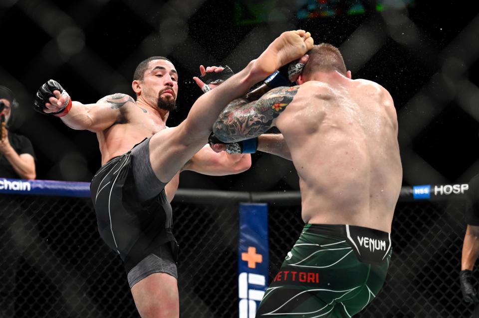Sep 3, 2022; Paris, FRANCE; Robert Whittaker (red gloves) and Marvin Vettori (blue gloves) during UFC Fight Night at Accor Arena. Mandatory Credit: Per Haljestam-USA TODAY Sports