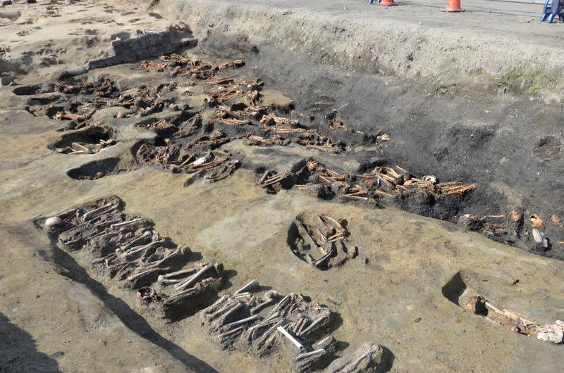 Handout photo shows Burial ground containing the bones of people are seen at an excavations site called 'Umeda Tomb", at a construction site for a train station, in Osaka, western Japan