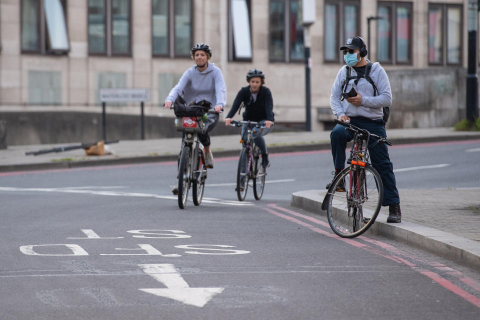 Cyclists ride in Waterloo, London, as the UK continues in lockdown to help curb the spread of the coronavirus.