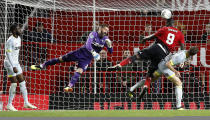 Manchester United's Romelu Lukaku, top right, attempts a shot on goal during the English League Cup, third round soccer match at Old Trafford in Manchester, England, Tuesday Sept. 25, 2018. (Martin Rickett/PA via AP)