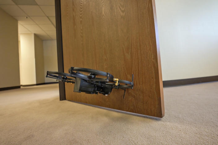 A drone designed to be used by SWAT teams opens a door during a demonstration for NBC News. (Ray Farmer / NBC News)