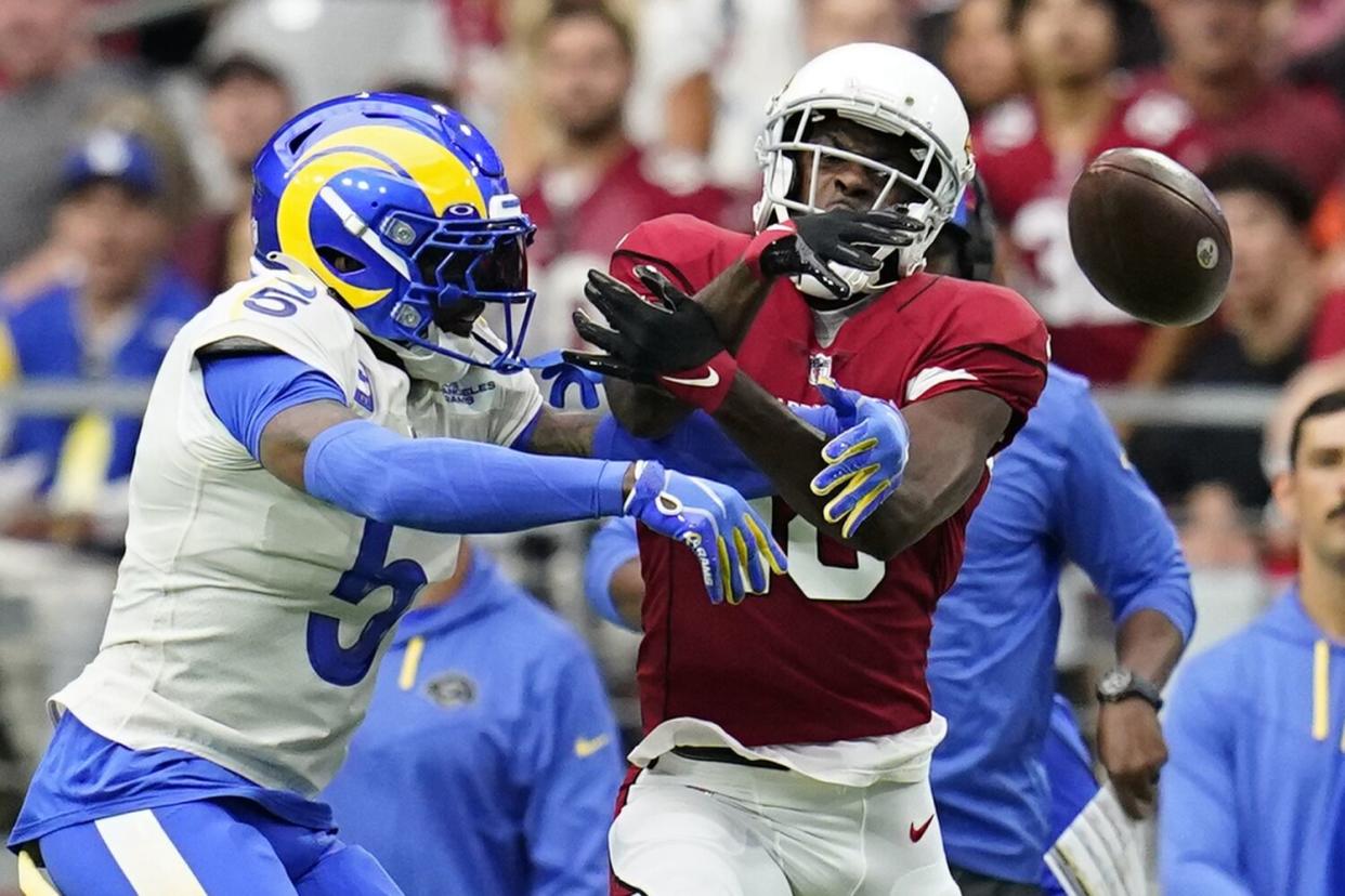 Rams cornerback Jalen Ramsey (5) breaks up a pass intended for Cardinals wide receiver A.J. Green in the first half.