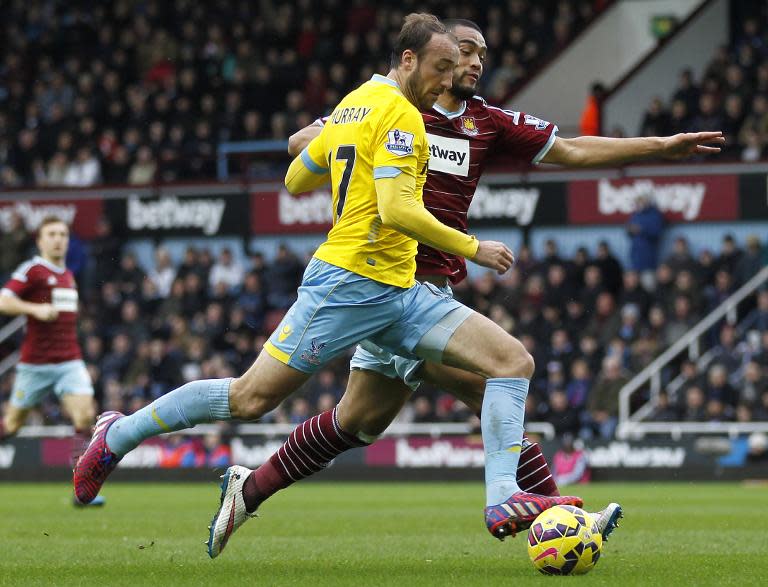 Crystal Palace's English striker Glenn Murray (L) vies with West Ham United's New Zealand defender Winston Reid during their English Premier League football match in Upton Park, East London on February 28, 2015