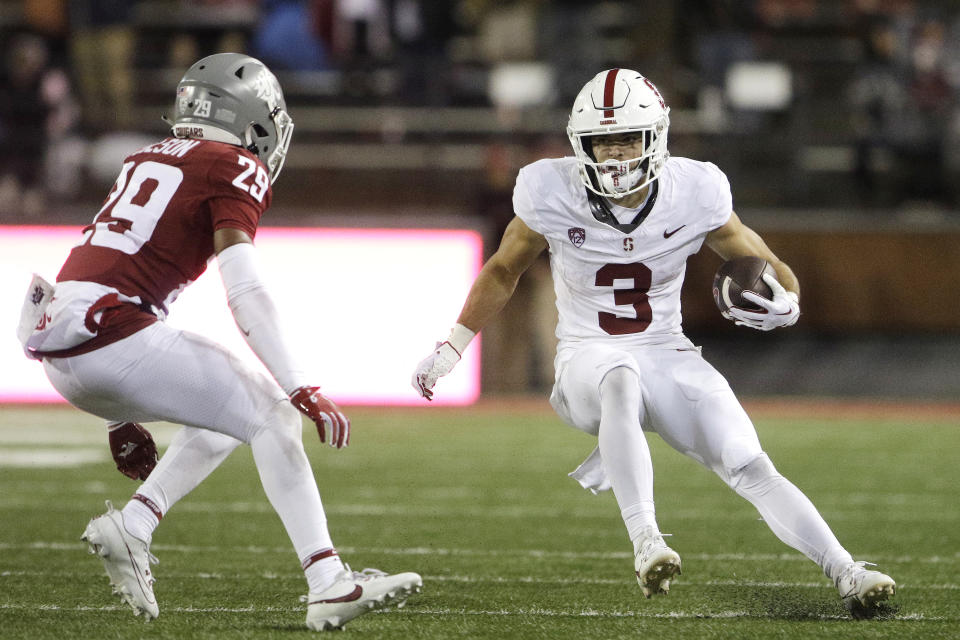 Stanford wide receiver Bryce Farrell (3) carries the ball while pressured by Washington State defensive back Jamorri Colson (29) during the second half of an NCAA college football game, Saturday, Nov. 4, 2023, in Pullman, Wash. Stanford won 10-7. (AP Photo/Young Kwak)