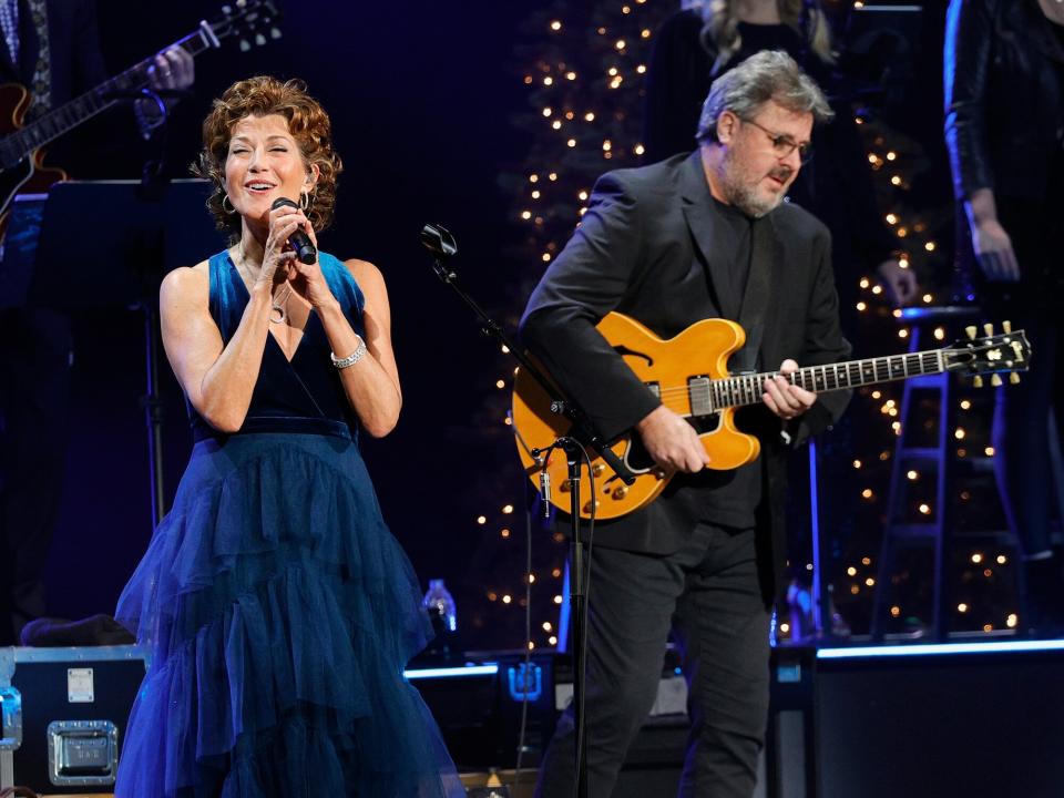 Amy Grant and Vince Gill perform at the Ryman Auditorium on December 13, 2021 in Nashville, Tennessee