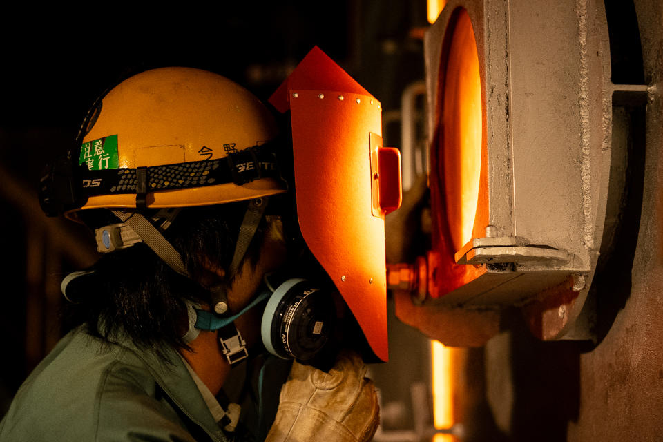 One of PAMCO's experienced operating personnel monitors the production of calcine inside the Rotary Kiln Electric-Arc Furnace.