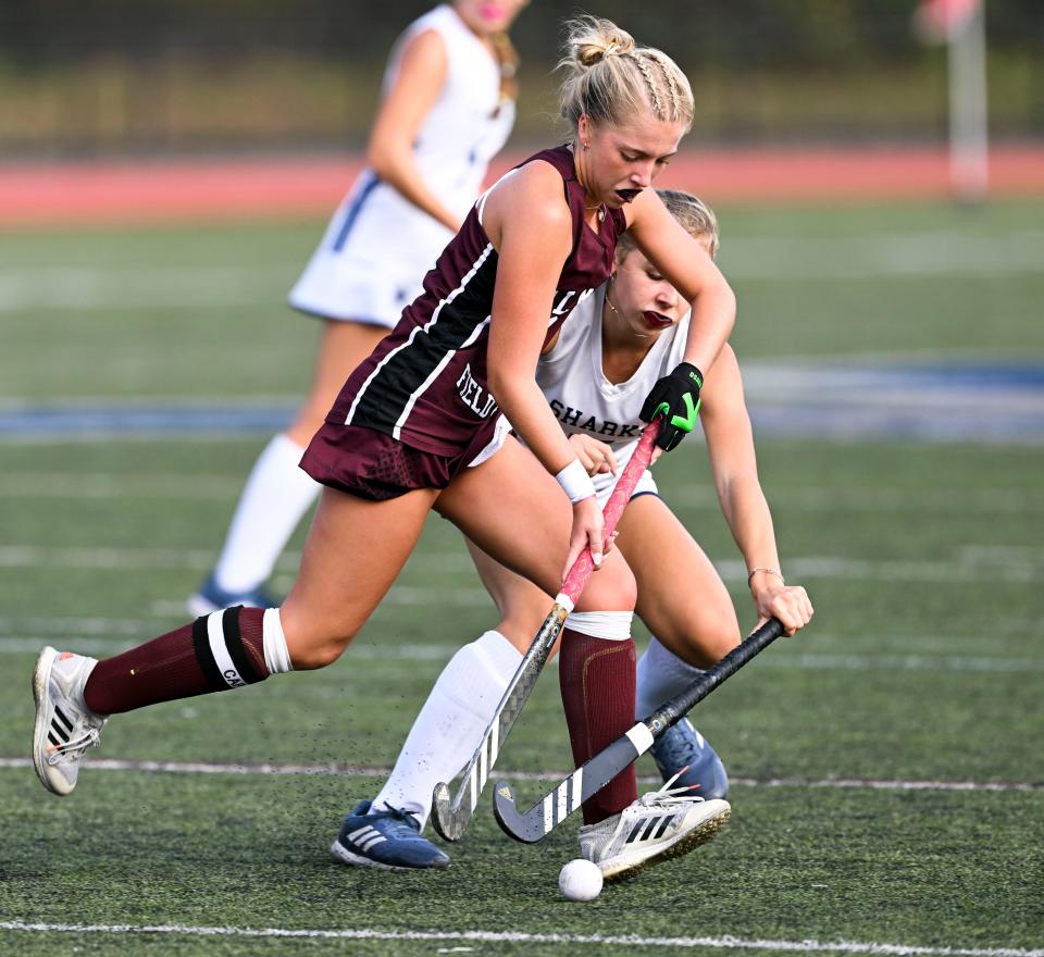 Avery Johnsen of Falmouth attempts to get past Tessa Grodzicki of Monomoy.