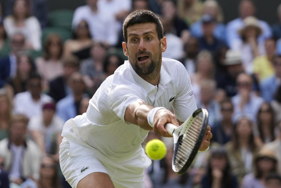 FILE - Serbia's Novak Djokovic returns to Spain's Carlos Alcaraz in the final of the men's singles on day fourteen of the Wimbledon tennis championships in London, Sunday, July 16, 2023. Djokovic is one of the men to watch at the U.S. Open, which begins at Flushing Meadows on Aug. 28.(AP Photo/Kirsty Wigglesworth, File)