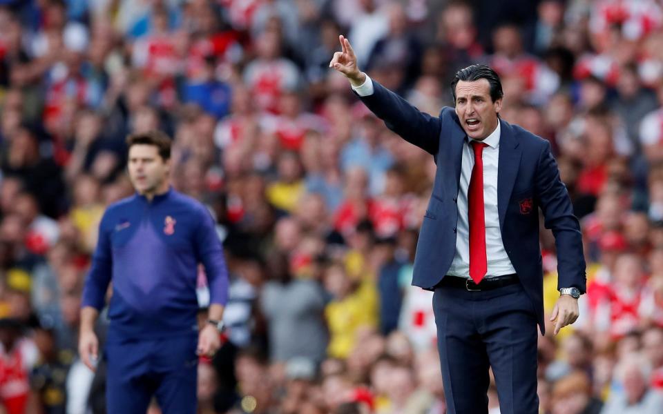 Unai Emery and Mauricio Pochettino on the sidelines during this season's first north London derby - Reuters